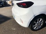 a white car that is parked in a parking lot