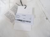 the label on a white shirt is attached to a hanger
