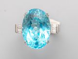 an oval blue topaze and diamond ring
