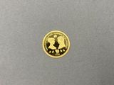 a close up of a gold coin with a picture of a man on a horse