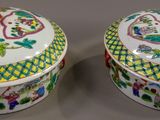 pair of chinese famille porcelain covered boxes with floral designs