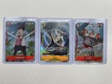 three different pokemon trading cards in plastic cases on a table
