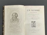 an open book with a picture of a man in a suit on it