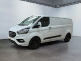 the white van is parked in a large room