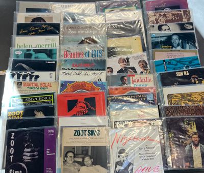 a lot of cd ' s that are on a table