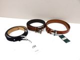 three belts with tags on them sitting on a white surface