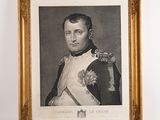 an old picture of a man in a military uniform in a gold frame