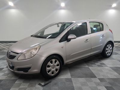 a picture of a silver car parked in a garage