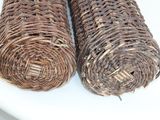two rolls of wicker sitting on a white table