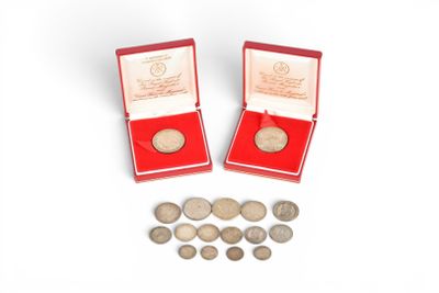 two red boxes with silver coins and a red box with silver coins