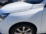 a white car that is parked in a parking lot