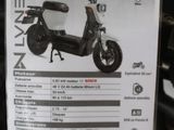 a scooter with a price tag attached to it