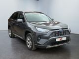 the toyota rav is parked in a large room