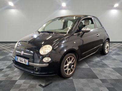 a picture of a small black car on a checkered floor
