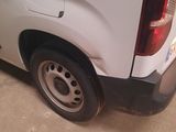 a white van that is parked in a garage