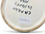 an image of a white plate with writing on it