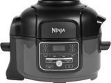 a close up of a black rice cooker on a white background