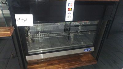 a display case that has a lot of food inside of it