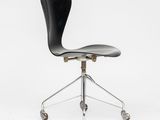 a black office chair with wheels on a white background