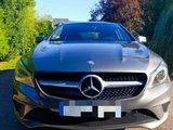 mercedes s - class coupe in silver parked on the side of the road