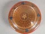 a small plate with a star on it on a table