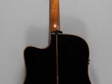 a close up of an acoustic guitar on a white background