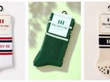 three pairs of men ' s socks hanging on a hanger