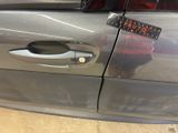 a sticker on the door handle of a car that has a sticker on it