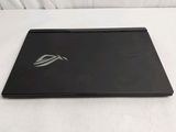 a black laptop with a logo on it on a white surface