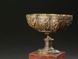 an image of a marble bowl sitting on top of a wooden stand