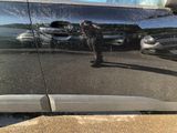 a reflection of a man in a car window