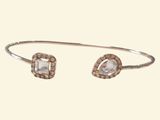 a close up of a bracelet with a white stone on it