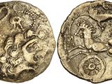 a silver coin with an image of a man on a horse