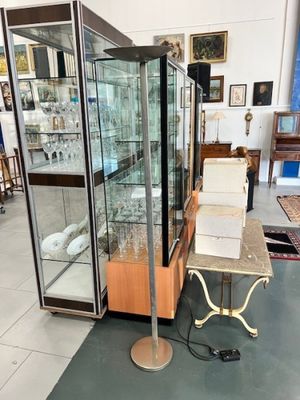 a display case with a glass door in the middle of a room
