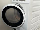 a washer and dryer in the corner of a room