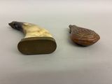 pair of antique carved horn handles and a carved bird