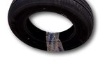 a tire that is sitting on a white surface