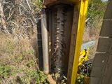 a yellow box that has a bunch of plants growing out of it