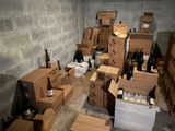 many boxes and bottles of wine on the floor