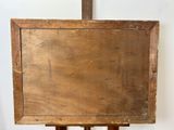 an old wooden easel with a painting on top of it