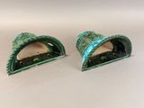 pair of green and white ceramic figurines of shells