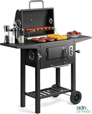 an image of a barbecue grill with meats and vegetables on it