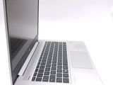 a close up of a laptop computer on a white surface