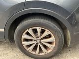 a close up of a car ' s tire on the ground