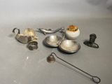 a lot of silver items that are on the table