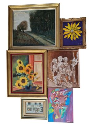 many paintings on the wall of this room