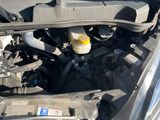 the engine of a car with the hood open and the hood open