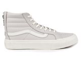 a pair of white high top sneakers with zippers on the side