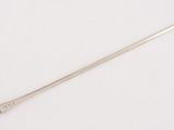 an image of a spoon with a metal handle on a white surface