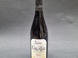 a bottle of wine sitting on top of a table